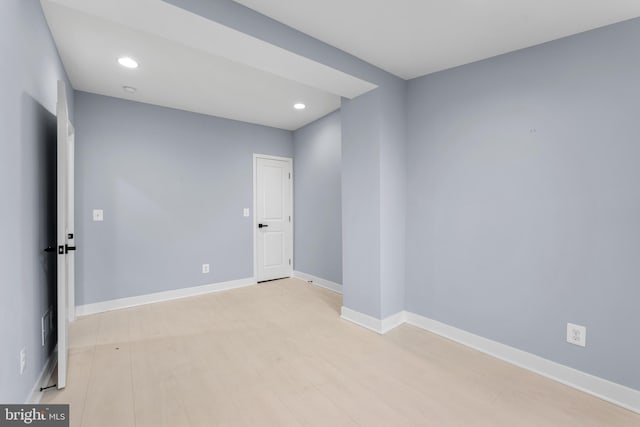 unfurnished room with light hardwood / wood-style flooring