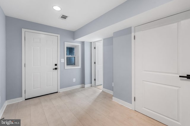 foyer with light hardwood / wood-style floors