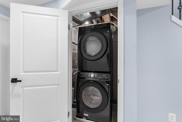 laundry room with stacked washer / dryer