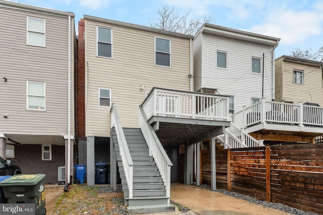 back of property featuring a deck