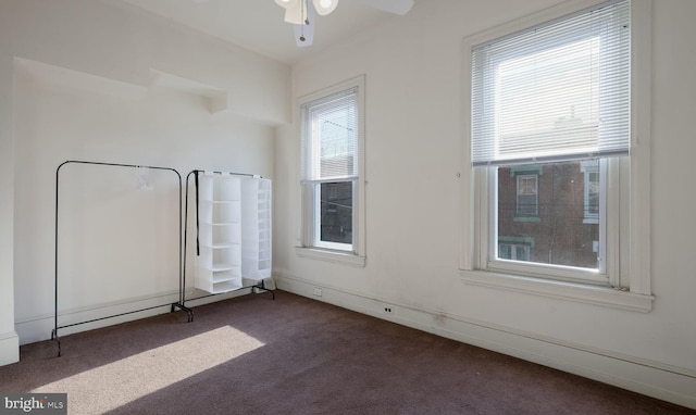 carpeted empty room with ceiling fan