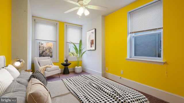 sitting room with carpet floors and ceiling fan