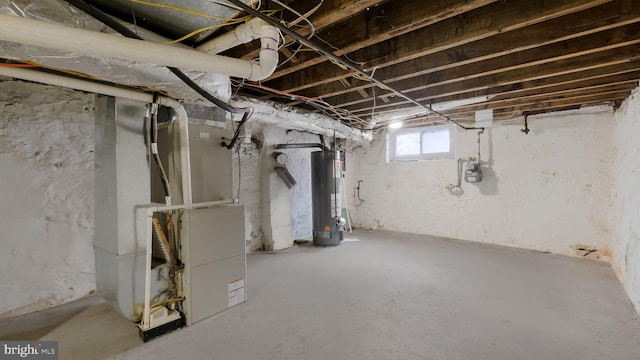 basement featuring heating unit and gas water heater