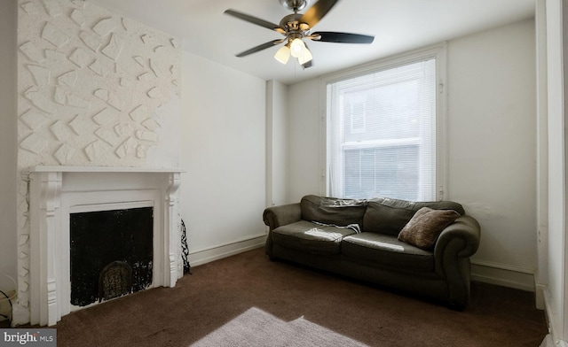 living room with dark colored carpet and ceiling fan