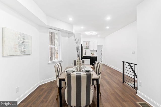 dining room featuring dark wood-type flooring