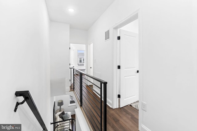 hallway with dark hardwood / wood-style floors