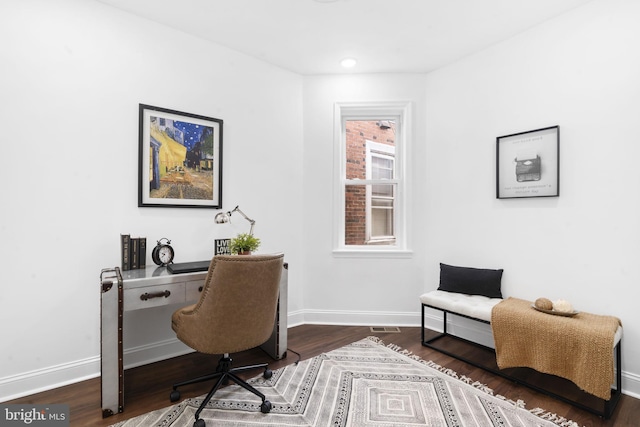 home office with dark wood-type flooring