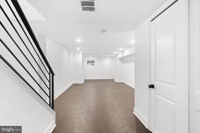 basement with dark wood-type flooring