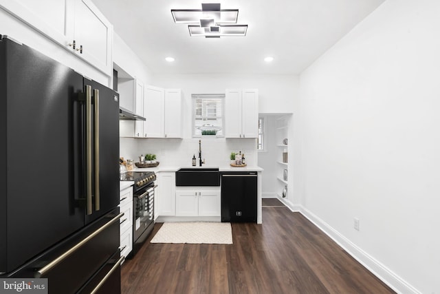 kitchen with dishwasher, stainless steel electric range, sink, high quality fridge, and white cabinetry