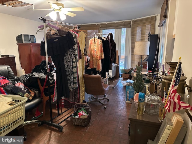 miscellaneous room featuring ceiling fan