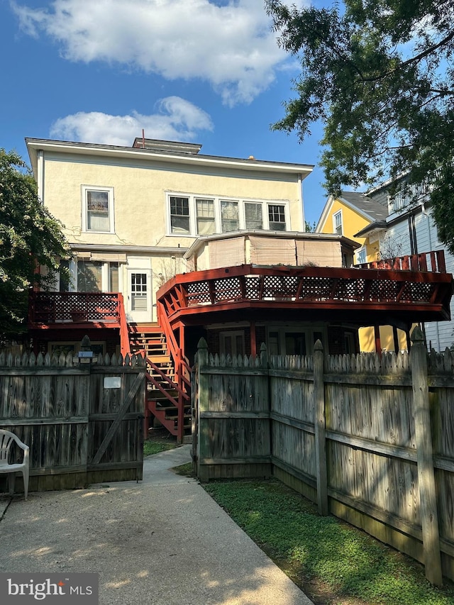 rear view of house with a deck