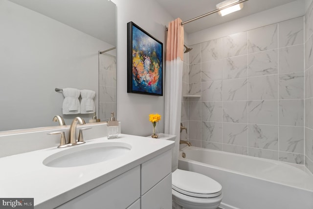 full bathroom featuring vanity, shower / bath combo, and toilet