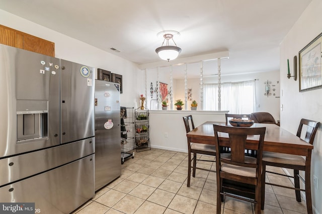 kitchen with light tile patterned floors, stainless steel fridge, and stainless steel refrigerator