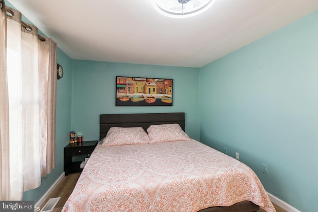 bedroom with hardwood / wood-style floors