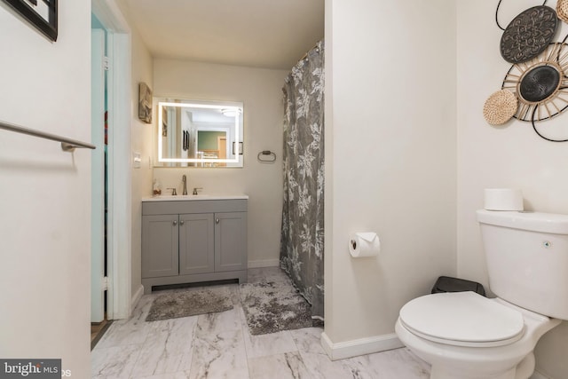 bathroom featuring toilet and vanity