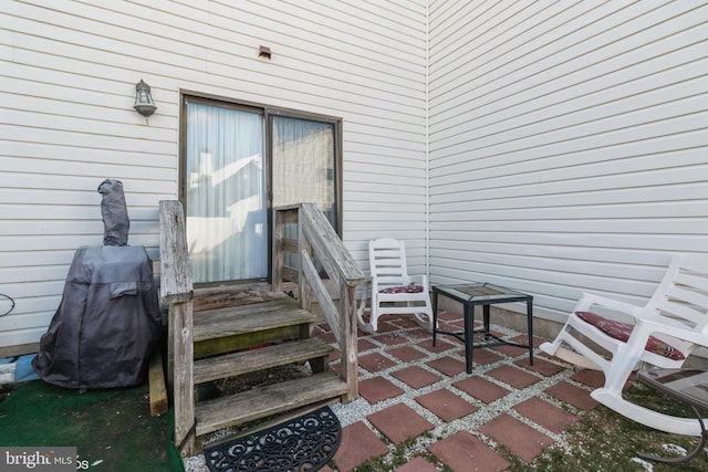 entrance to property featuring a patio