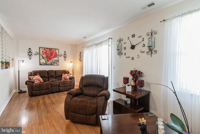 living room with light hardwood / wood-style flooring