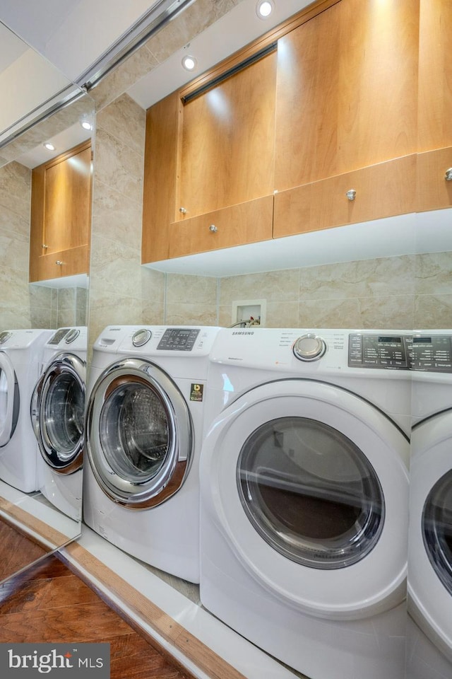 laundry area with cabinets and washer and dryer