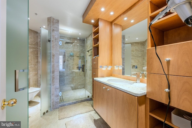 bathroom featuring vanity, walk in shower, and tile walls