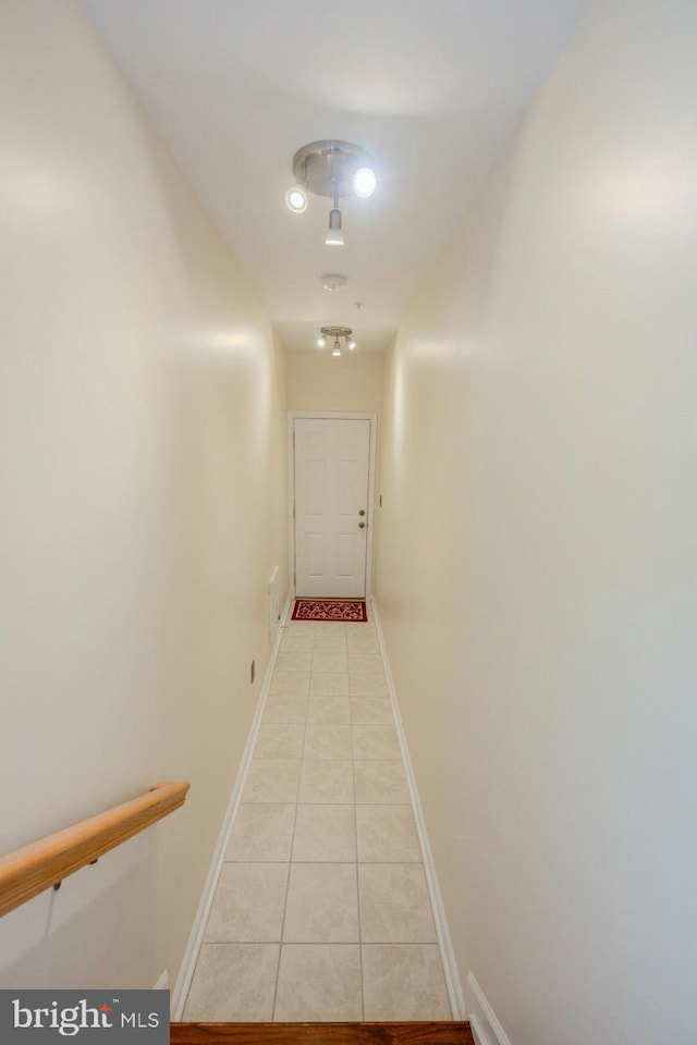 hallway with light tile patterned floors