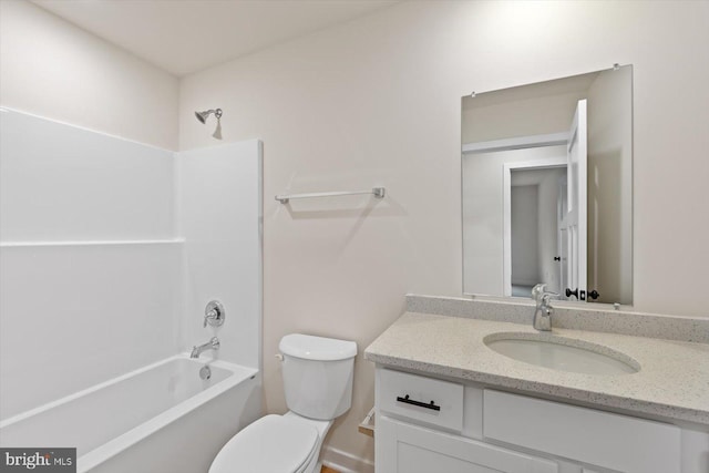 full bathroom with vanity, toilet, and washtub / shower combination