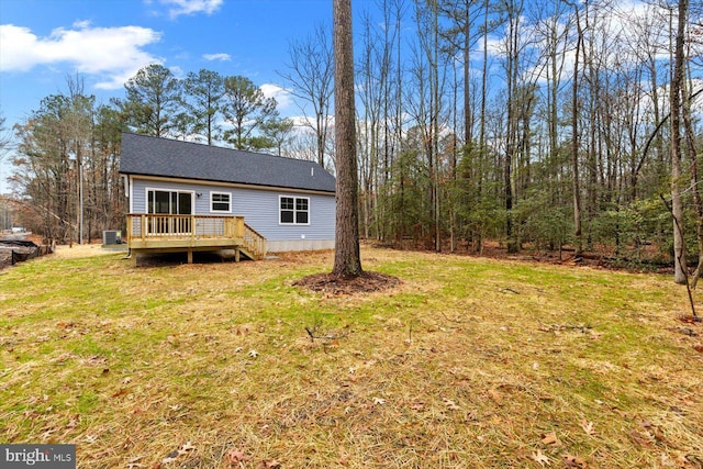 exterior space featuring a yard and a wooden deck