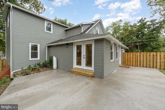 rear view of property featuring a patio area and french doors