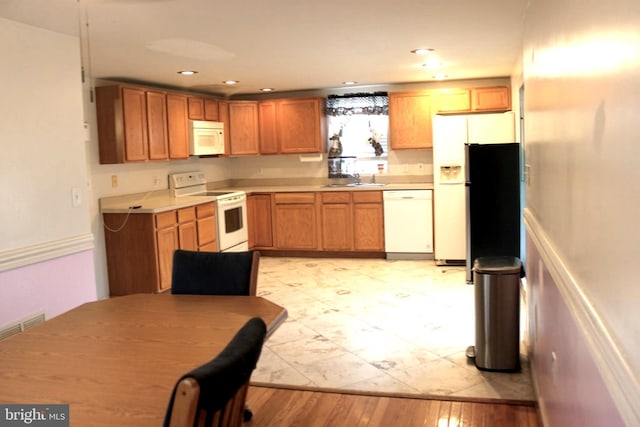 kitchen with white appliances and sink