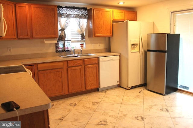 kitchen with white appliances and sink