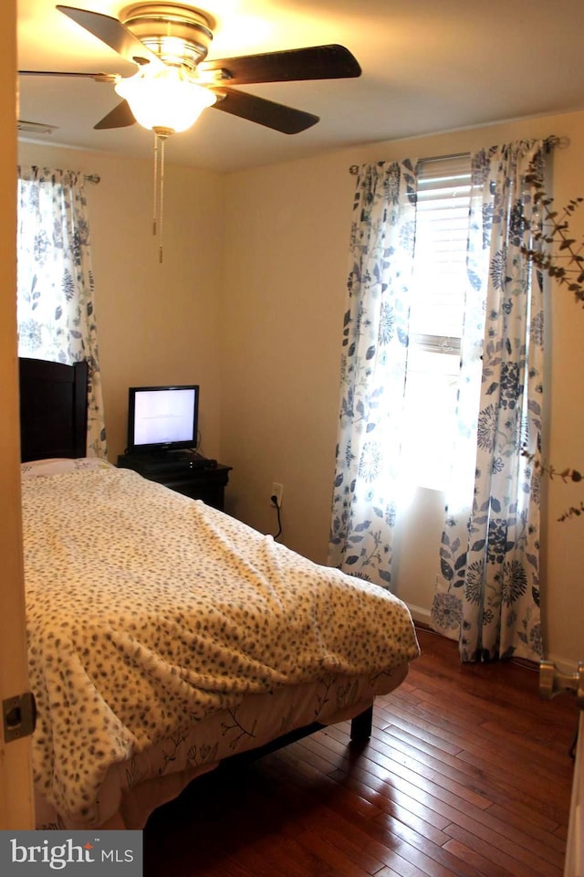 bedroom with hardwood / wood-style flooring and ceiling fan