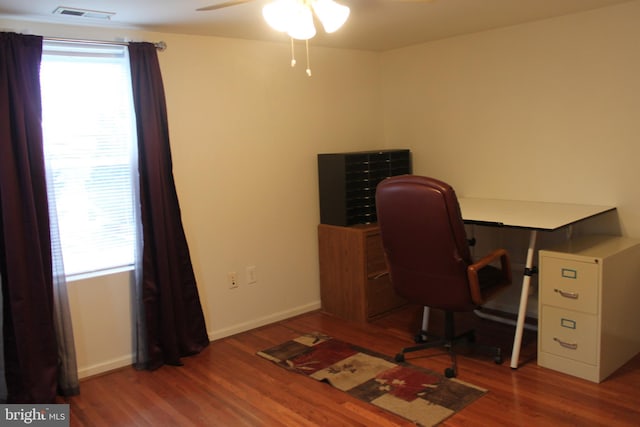 office space featuring hardwood / wood-style flooring, plenty of natural light, and ceiling fan