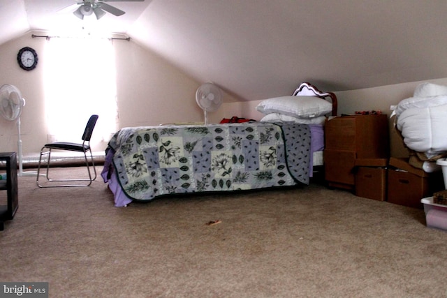 carpeted bedroom with ceiling fan and lofted ceiling