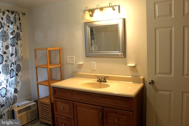 bathroom with a wall mounted air conditioner and vanity