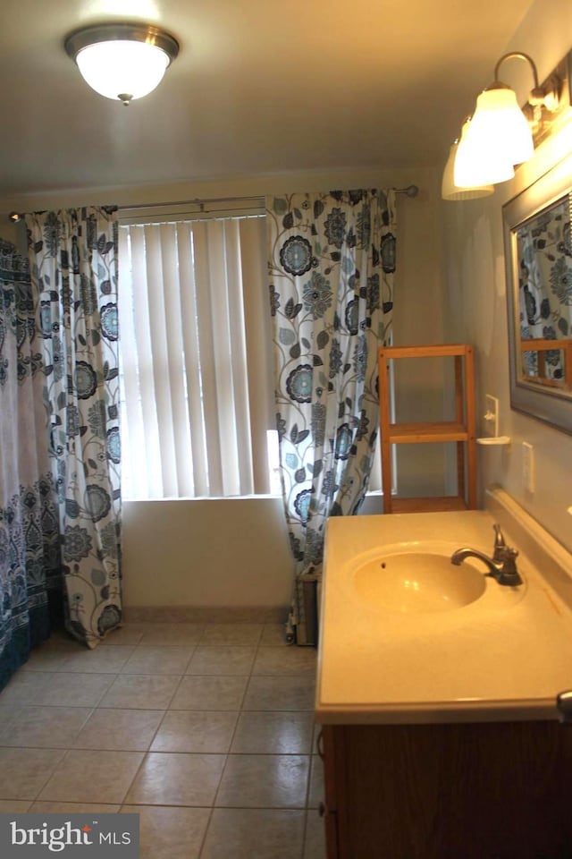 bathroom featuring tile patterned flooring and vanity