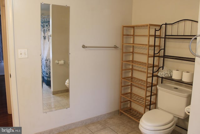 bathroom featuring tile patterned flooring and toilet