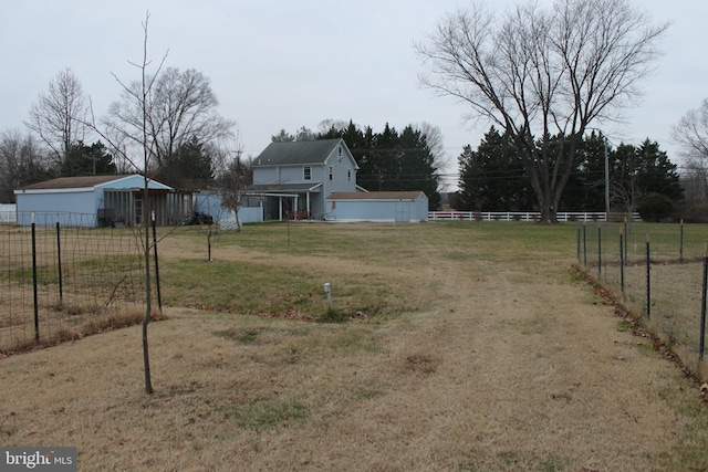 view of yard with a rural view