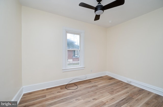 empty room featuring ceiling fan and light hardwood / wood-style flooring