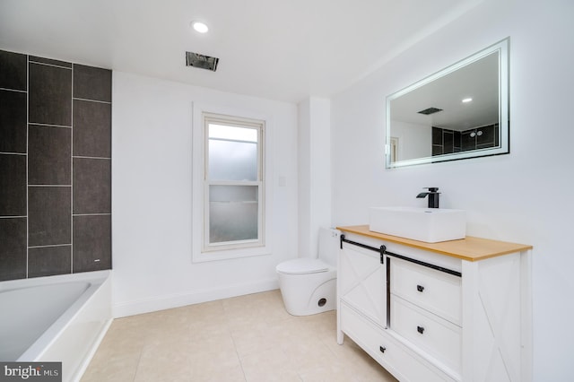 bathroom with tile patterned flooring, vanity, and toilet