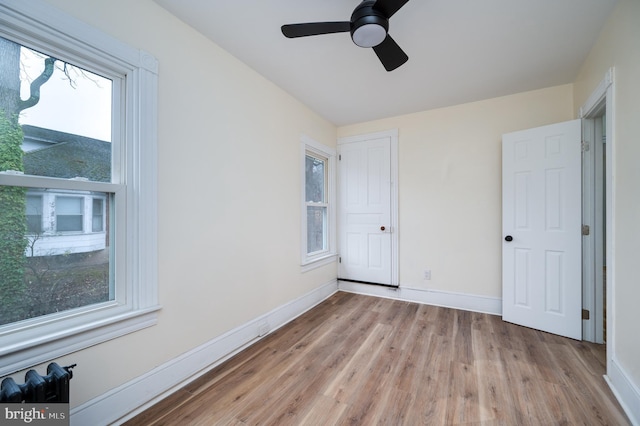 unfurnished bedroom featuring ceiling fan and light hardwood / wood-style floors