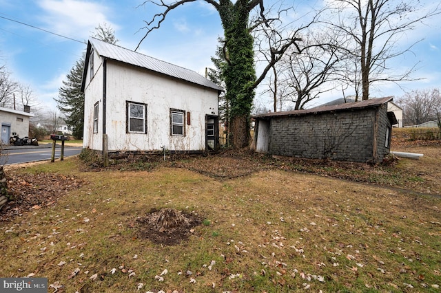 rear view of house with a lawn