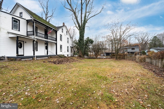 view of yard featuring a balcony