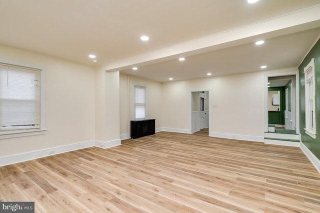 unfurnished living room with light hardwood / wood-style flooring