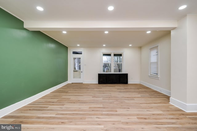 unfurnished living room with light wood-type flooring