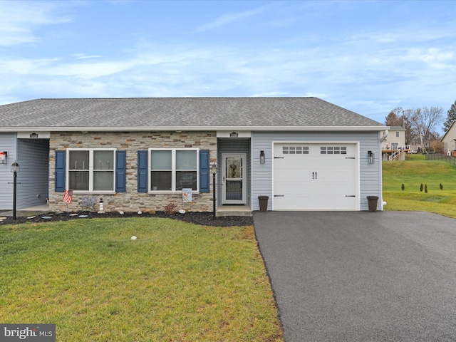 ranch-style home with a front yard and a garage