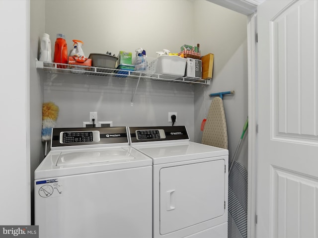 washroom with washer and dryer