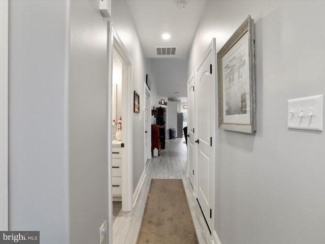 hall with light wood-type flooring