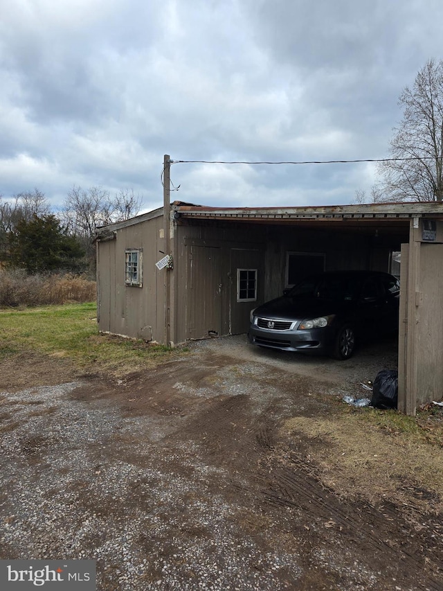 exterior space with a carport