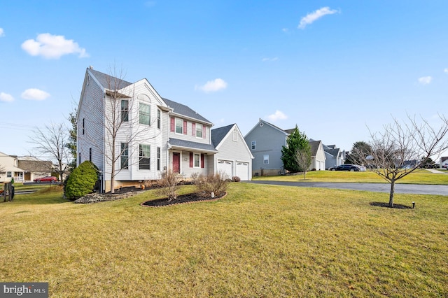 front facade with a garage and a front lawn