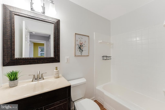 full bathroom featuring toilet, tub / shower combination, and vanity