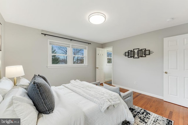 bedroom with hardwood / wood-style floors